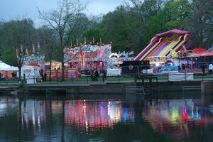 High Angle Footage of Public Funfair Held at Lewsey Public Park of Luton with Free Access for Muslim Community on Islamic Holy Eid Festival Day. April 23rd, 2023 photo