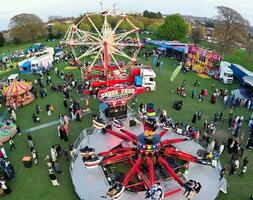 High Angle Footage of Public Funfair Held at Lewsey Public Park of Luton with Free Access for Muslim Community on Islamic Holy Eid Festival Day. April 21st, 2023 photo