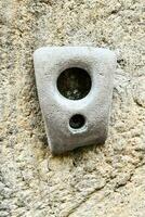 a cement block with a hole in it photo