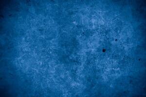 Old wall pattern texture cement blue dark abstract  blue color design are light with black gradient background. photo