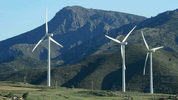 Wind turbines energy renewable moving at the mountains video