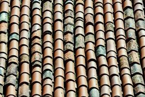 a close up of a roof with many different types of tiles photo