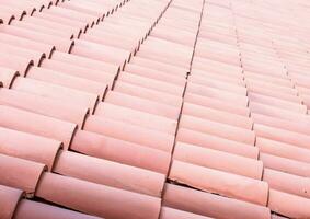 a close up of a roof with many different colored tiles photo