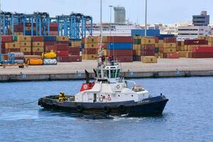 a tug boat in the port of almeria, spain photo