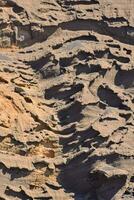 a rock formation with many different patterns photo