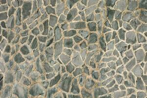 a close up of a stone wall with a pattern photo