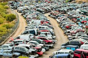 a large lot of cars are parked in a parking lot photo