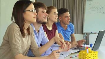 Creative team watches some presentation video