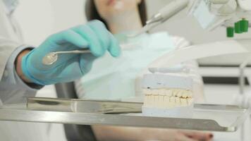 Cropped shot of a dental mold at the medical tools table of a dentist video