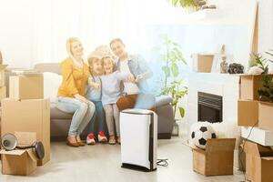 family with an air purifier moving to a new apartment photo