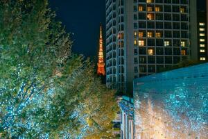 Tokyo Tower with Roppongi Hills Christmas Illumination, light up christmas market in Tokyo, Japan., landmark and popular for tourists attraction in Tokyo. Travel, holiday and celebrations concept photo