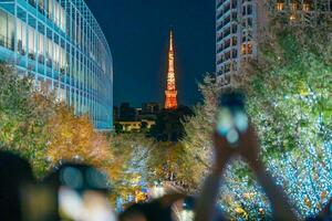 Tokyo Tower with Roppongi Hills Christmas Illumination, light up christmas market in Tokyo, Japan., landmark and popular for tourists attraction in Tokyo. Travel, holiday and celebrations concept photo