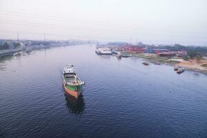 Aerial view Landscape of Sand bulkheads ships with Industrial zone in Sitalakhya River, Narayanganj, Bangladesh photo