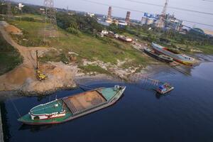 Top view of Sand bulkheads ships Waiting for unloaded in Sitalakhya River, Narayanganj, Bangladesh photo