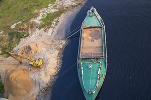 Top view of Sand bulkheads ships Waiting for unloaded in Sitalakhya River, Narayanganj, Bangladesh photo