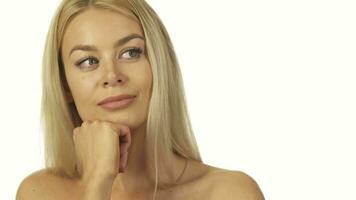 The incredibly beautiful girl thoughtfully standing against a white wall video