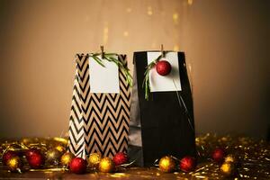 Christmas gift bags with decor and Christmas ornament. photo