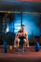 man doing exercises with barbell photo