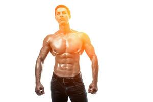 Muscular handsome young man with naked torso. Isolated on white photo