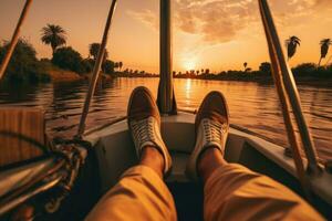 ai generado piernas de un hombre en blanco zapatillas en un barco en el río a atardecer, un irreconocible descalzo masculino viajero sentado en el borde de un barco durante un crucero en el ondulación Nilo río foto