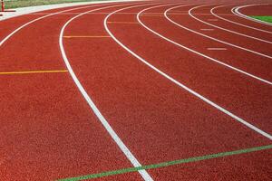 Red treadmill in sport field. photo