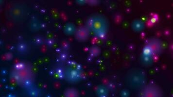 Colorful glowing bokeh particles abstract motion animated background video