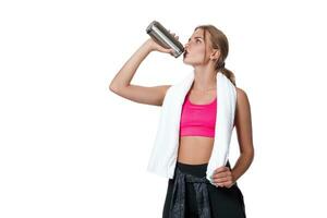 Portrait of sporty young woman tired after a gym workout photo