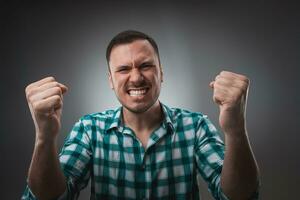 Portrait of man isolated on gray background. Man showing different emotions. photo