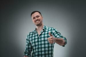 Portrait of man on gray background. Man showing different emotions. photo