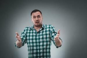 Portrait of man isolated on gray background. Man showing different emotions. photo