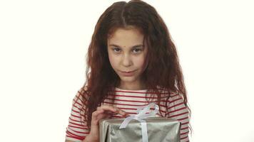 A cunning girl unpacks her New Year gift video