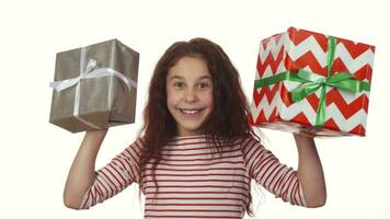 Happy girl holding two Christmas gifts in her hands video