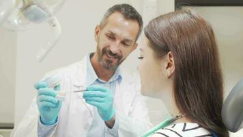 Attractive woman smiling to the camera during appointment with the dentist video