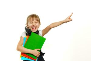 Blonde schoolgirl holds large book, shoot over white background photo