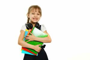 little blond school girl with backpack bag portrait isolated on white background photo