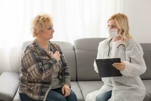 older Patient and doctor are smiling photo