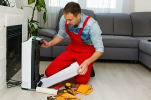 air purifier repairman turning a filter into a new one. photo