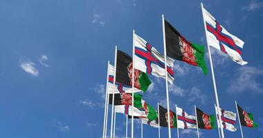 Afghanistan and Faroe Islands Flags Waving Together in the Sky, Seamless Loop in Wind, Space on Left Side for Design or Information, 3D Rendering video