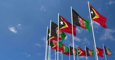 Afghanistan and East Timor Flags Waving Together in the Sky, Seamless Loop in Wind, Space on Left Side for Design or Information, 3D Rendering video