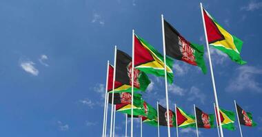 Afghanistan and Guyana Flags Waving Together in the Sky, Seamless Loop in Wind, Space on Left Side for Design or Information, 3D Rendering video