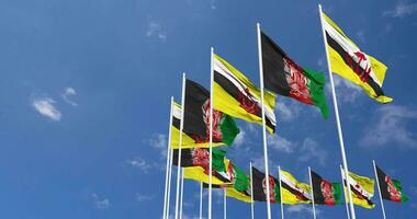Afghanistan and Brunei Flags Waving Together in the Sky, Seamless Loop in Wind, Space on Left Side for Design or Information, 3D Rendering video