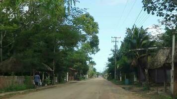 Kantunilkin Quintana Roo Mexico 2021 Driving through village Solferino mud and tropical jungle Mexico. video