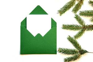 creativo diseño hecho desde un Navidad árbol rama y un hecho a mano sobre. sitio para texto. foto