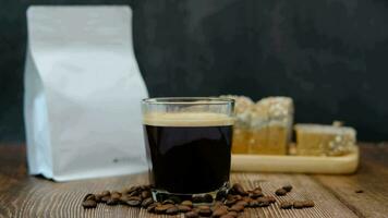 front view of a black coffee mug on a black background video