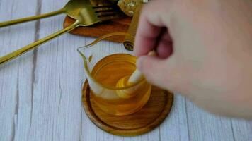 Male hand pouring honey With bread for breakfast video