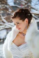 Bride in the winter against the backdrop of New York photo