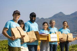 Diversity group of volunteer people joining together in money raising event for charity donation work and ngo related activity such as global warming, environmental issues, pollution concept photo