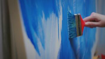 Woman with painting skill in studio. photo