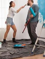 Enjoying the renovation by singing and dancing at tools. Apartment redecoration and home construction while renovating and improving. Repair and decorating. photo