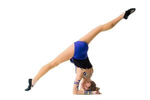 Young gymnast on a white background. photo